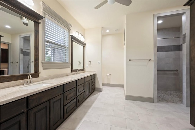 5217 Ruddy Duck Dr, College Station, TX 77845 - bathroom with double vanity, ceiling fan, a walk in shower, tile patterned flooring, and recessed lighting
