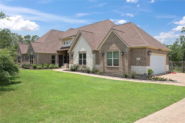5217 Ruddy Duck Dr, College Station, TX 77845 - view of front of home featuring brick siding, a garage, concrete driveway, a front yard, and stone siding