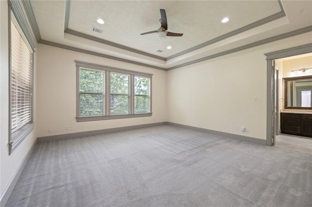 5217 Ruddy Duck Dr, College Station, TX 77845 - spare room featuring a raised ceiling, light carpet, ceiling fan, ornamental molding, and recessed lighting