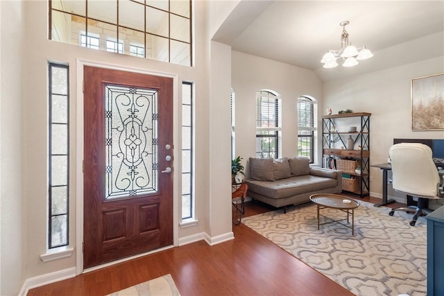 4205 Cripple Creek Ct, College Station, TX 77845 - foyer with a chandelier, wood finished floors, baseboards, and vaulted ceiling