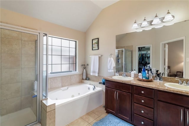 4205 Cripple Creek Ct, College Station, TX 77845 - bathroom featuring a stall shower, vaulted ceiling, a tub with jets, double vanity, and tile patterned floors