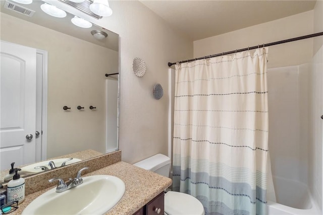 4205 Cripple Creek Ct, College Station, TX 77845 - bathroom featuring vanity, toilet, and shower / tub combo with curtain
