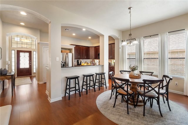 4205 Cripple Creek Ct, College Station, TX 77845 - dining area with arched walkways, plenty of natural light, dark wood-style flooring, and recessed lighting
