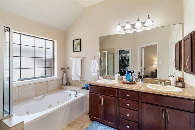 4205 Cripple Creek Ct, College Station, TX 77845 - bathroom featuring a shower stall, a whirlpool tub, double vanity, vaulted ceiling, and tile patterned floors