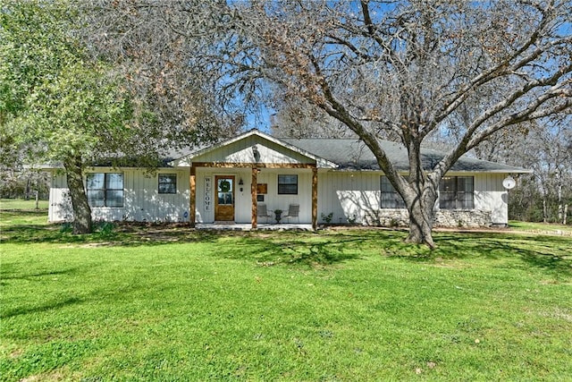 view of front of property with a porch and a front yard