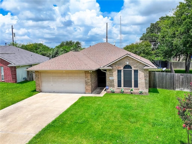 ranch-style house featuring a garage and a front yard