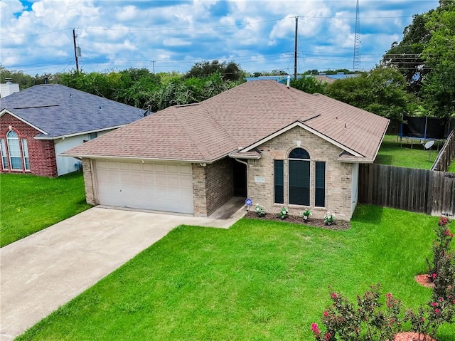 ranch-style house featuring a garage and a front lawn