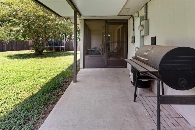 view of patio featuring a trampoline and grilling area