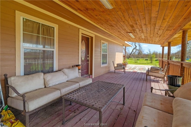 deck featuring covered porch and an outdoor living space