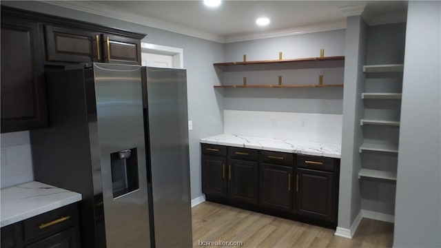 kitchen with stainless steel fridge with ice dispenser, crown molding, light hardwood / wood-style floors, and light stone counters