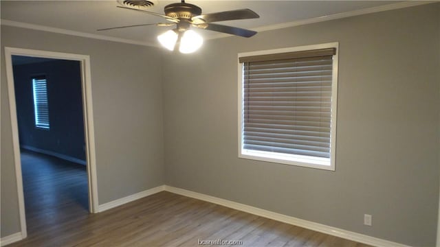 empty room featuring hardwood / wood-style floors, ceiling fan, and ornamental molding