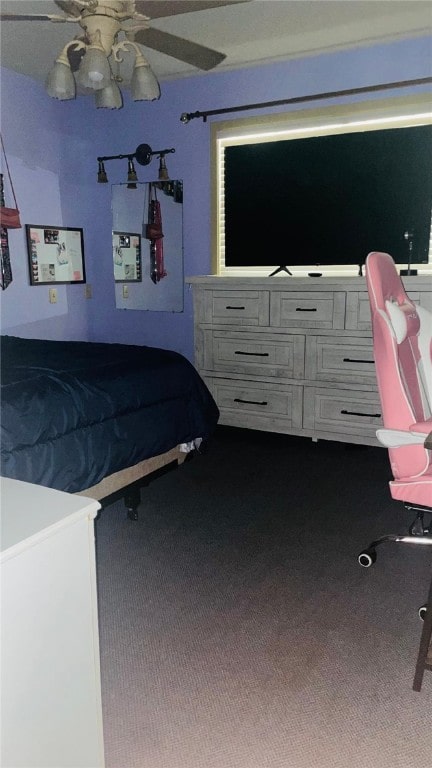 unfurnished bedroom featuring ceiling fan and carpet