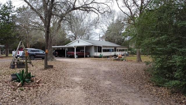 exterior space with a carport