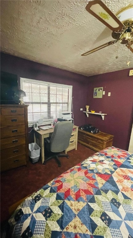 bedroom with ceiling fan and a textured ceiling