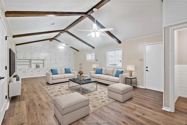 living room with lofted ceiling with beams, light hardwood / wood-style flooring, and ceiling fan