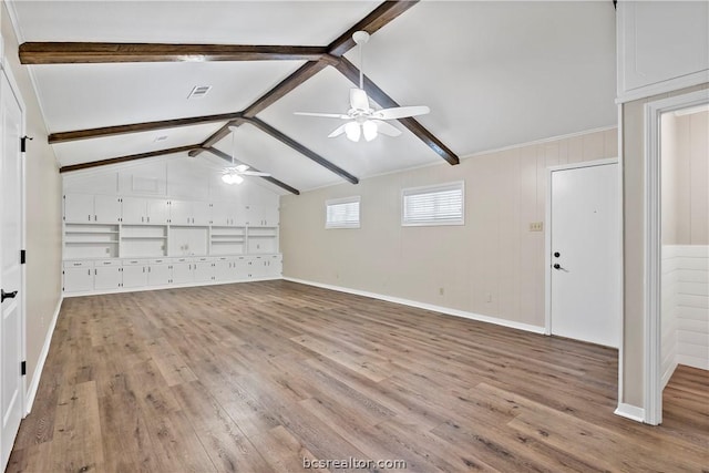 interior space featuring vaulted ceiling with beams, ceiling fan, and light wood-type flooring