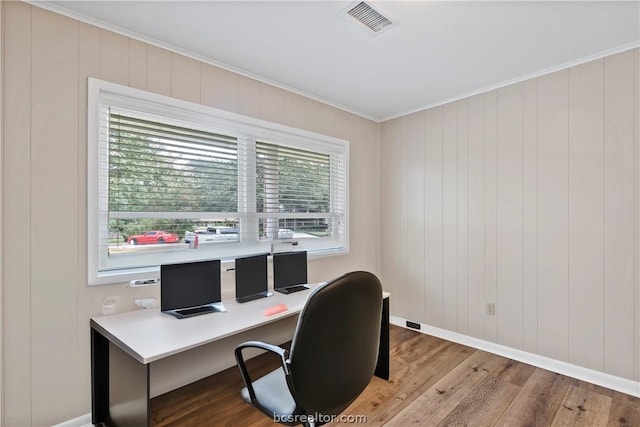 office area featuring light hardwood / wood-style floors and ornamental molding