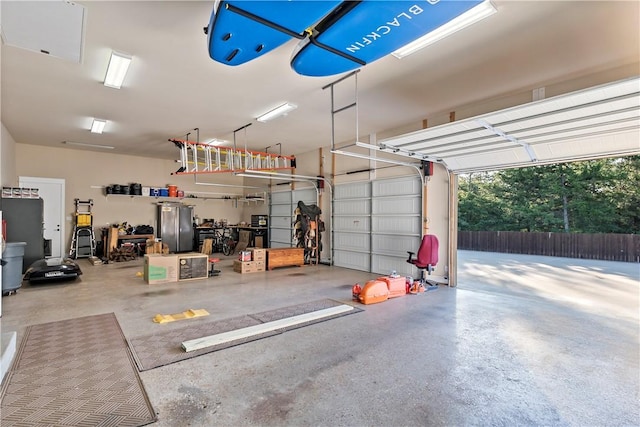 garage featuring stainless steel refrigerator