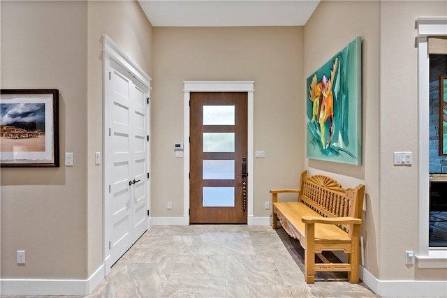 foyer entrance with baseboards