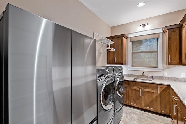 laundry room featuring separate washer and dryer and sink