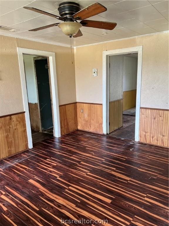 spare room featuring dark hardwood / wood-style floors and ceiling fan