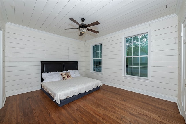 bedroom with wood ceiling, ceiling fan, wooden walls, and dark wood-type flooring