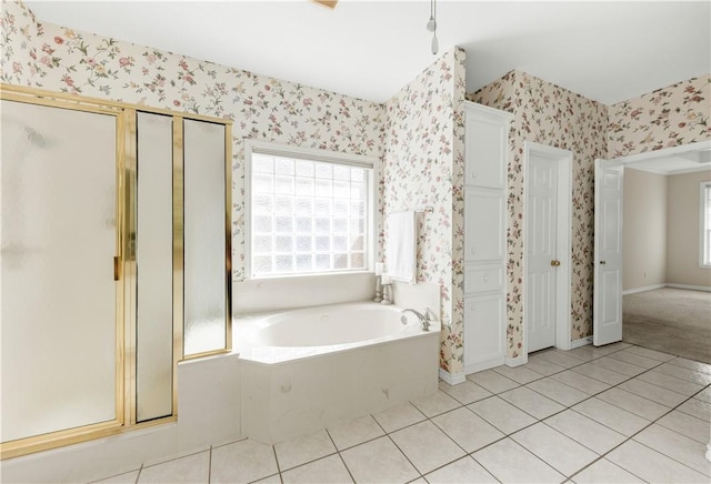 bathroom featuring tile patterned flooring and shower with separate bathtub