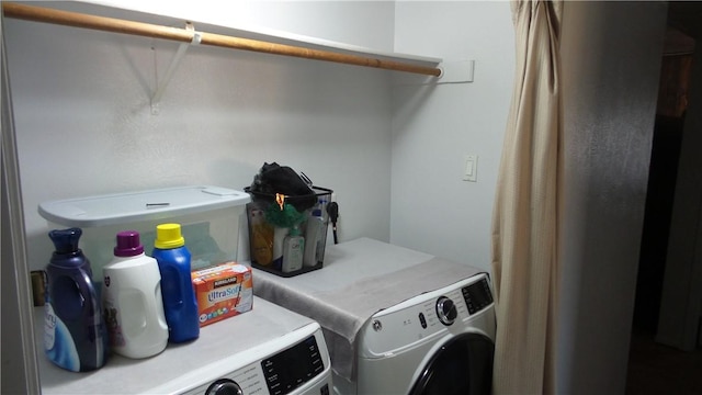 laundry room with washer and dryer