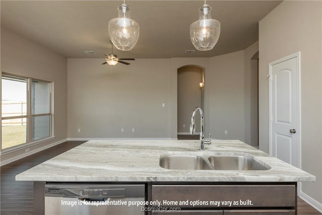 kitchen featuring stainless steel dishwasher, dark hardwood / wood-style flooring, sink, and hanging light fixtures