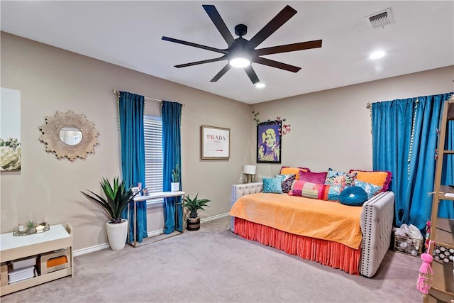 carpeted bedroom featuring ceiling fan