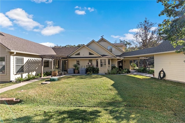 view of front of house with a front yard, a pergola, and central air condition unit