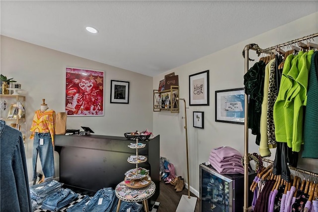 misc room featuring wine cooler and vaulted ceiling