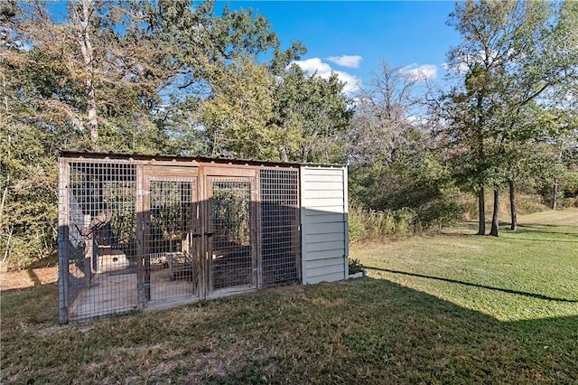 view of outdoor structure featuring a yard