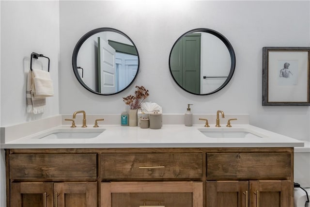 full bathroom featuring a sink and double vanity