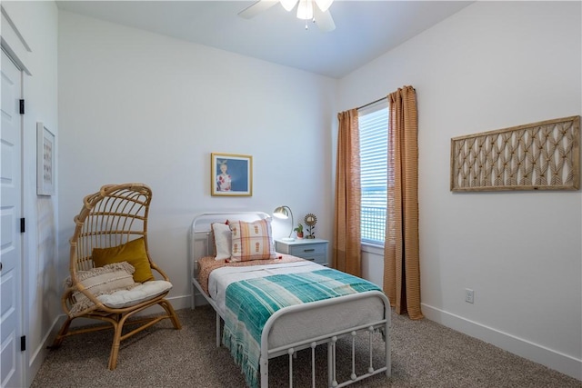 carpeted bedroom featuring baseboards and ceiling fan