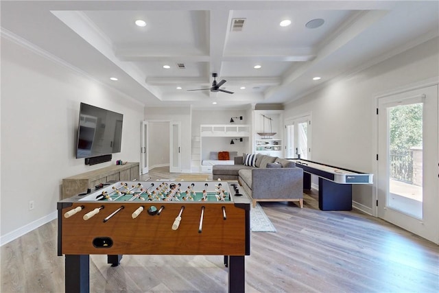 rec room with ceiling fan, beam ceiling, light hardwood / wood-style flooring, and coffered ceiling