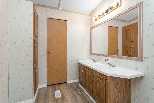 4794 Tall Pine Rd, Navasota, TX 77868 - bathroom featuring wood finished floors and double vanity