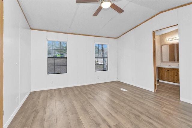 4794 Tall Pine Rd, Navasota, TX 77868 - empty room with vaulted ceiling, wood finished floors, ceiling fan, and crown molding