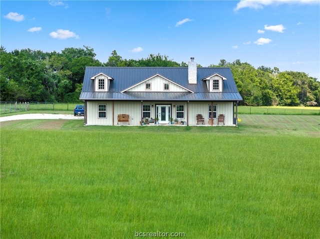 back of property featuring a yard