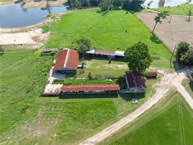 aerial view with a rural view and a water view