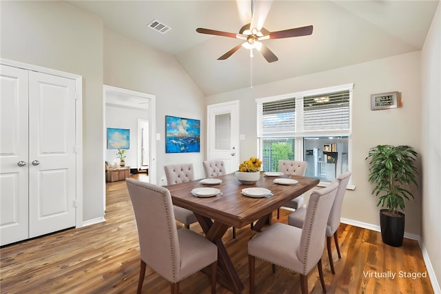 1208 High St, Navasota, TX 77868 - dining area with wood finished floors, visible vents, baseboards, ceiling fan, and vaulted ceiling