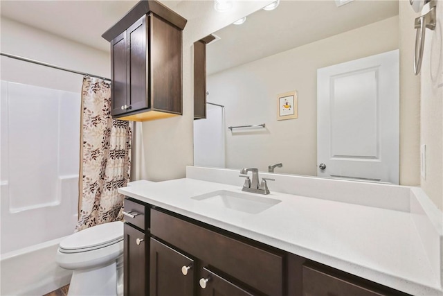 full bathroom featuring vanity and toilet