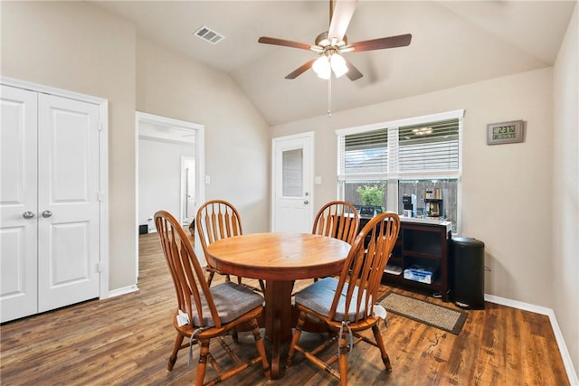 1208 High St, Navasota, TX 77868 - dining space with wood finished floors, visible vents, vaulted ceiling, a ceiling fan, and baseboards