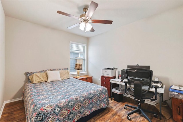 bedroom featuring baseboards, ceiling fan, and wood finished floors