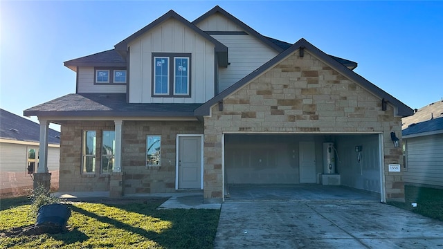 view of front of property with a garage and a front lawn