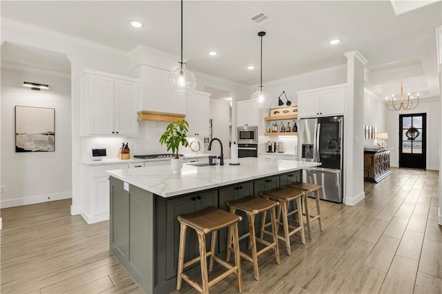 kitchen featuring visible vents, open shelves, light wood-style flooring, white cabinets, and appliances with stainless steel finishes