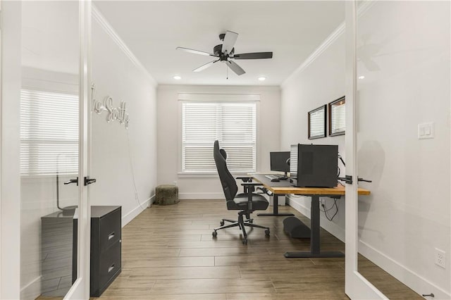 office area featuring a ceiling fan, baseboards, recessed lighting, light wood-style floors, and crown molding