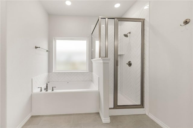 bathroom featuring shower with separate bathtub and tile patterned floors