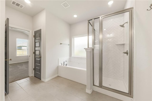 bathroom with plus walk in shower and tile patterned floors