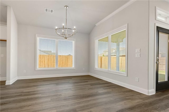 unfurnished dining area featuring a wealth of natural light, dark hardwood / wood-style flooring, and ornamental molding